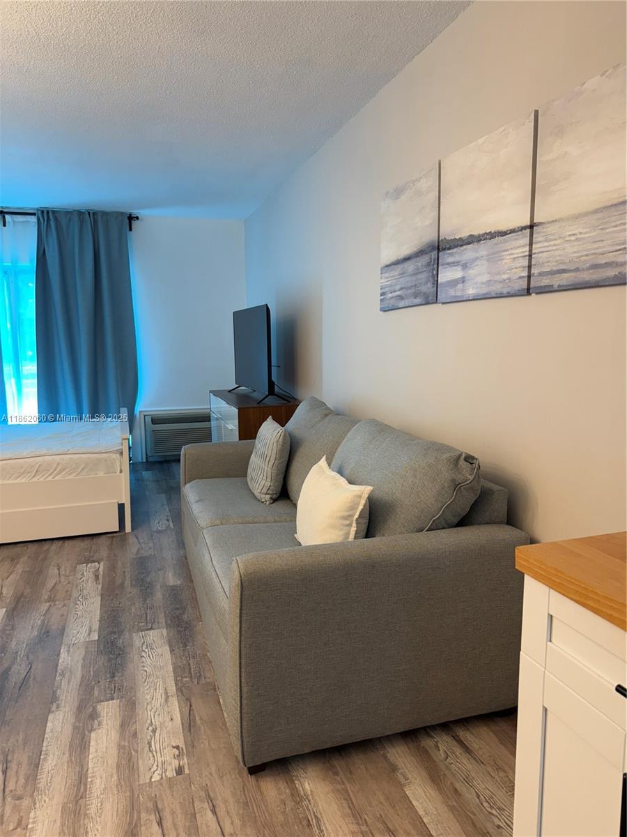 Nice fully furnished apartment steps front the beach , balcony with water views, building with security checkpoint, heated pool, business center!