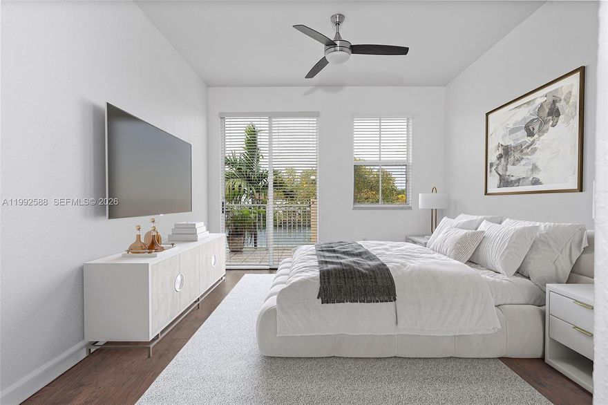 PREMIER WATERFRONT RESIDENCE. Discover sophisticated Miami living in this bright, light-filled 3-bedroom, 2.5-bathroom condo located in the desirable Las Sevillas community. Spanning approximately 1,491 square feet, this 2011-built home features a spacious open-concept layout enhanced by elegant tile and wood flooring. The modern kitchen showcases sleek finishes, flowing seamlessly into expansive living areas that lead to a private balcony with serene lake views. Retreat to the primary suite, complete with a generous walk-in closet and a private bath. Safety and comfort are prioritized with high-impact doors and a gated, fenced community setting. Residents enjoy access to a bike and jog path, along with two assigned parking spaces plus guest parking. Ideally situated near major highways, premier shopping, and top-tier dining, this move-in ready gem offers the perfect blend of convenience and luxury.