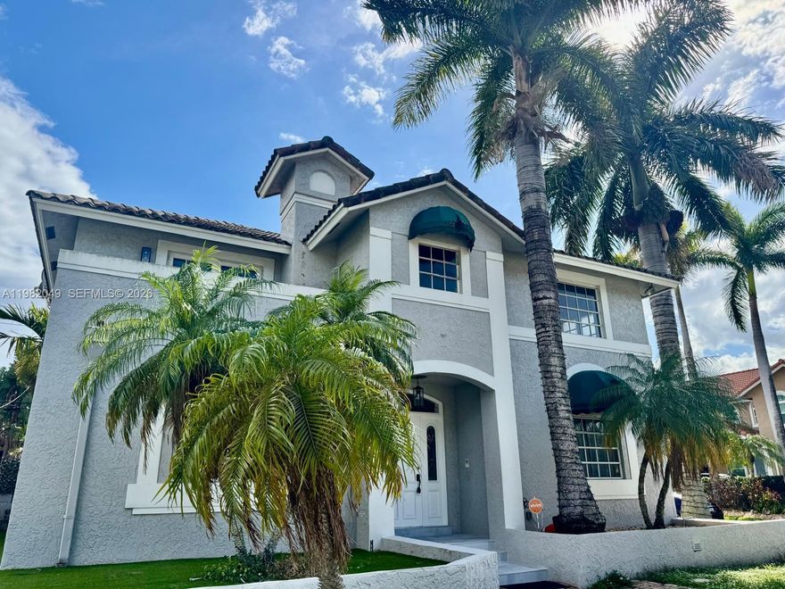 Ideally situated on a desirable corner lot in the heart of Hollywood Lakes, this artistically impressive 5-bed, 3.5-bath home is just a few blocks from the beach, the famous Hollywood Broadwalk, ArtsPark at Young Circle, dining, entertainment, and outdoor recreation right at your fingertips.

The main home features a spacious 3-bedroom, 2.5-bath layout designed for comfortable living and entertaining. The open kitchen is the heart of the home, complete with granite countertops, a cooking island, and stainless steel appliances, flowing effortlessly into the living spaces. A convenient bedroom and half bath are located on the first floor, perfect for guests.

Upstairs, you’ll find two beautiful primary suites, offering privacy and flexibility. The main primary bedroom includes a large walk-in closet, a private balcony, and a charming spiral staircase leading down to the patio, creating a peaceful retreat to enjoy the South Florida breeze.

Adding incredible versatility, the property also includes a separate 2-bed, 1-bath mother-in-law suite above the two-car garage, complete with its own private kitchen—ideal for extended family, guests, or potential rental income.

All of this is just minutes from Hollywood Beach, shopping, dining, nightlife, and Fort Lauderdale-Hollywood International Airport, making this home the perfect blend of location, lifestyle, and opportunity.