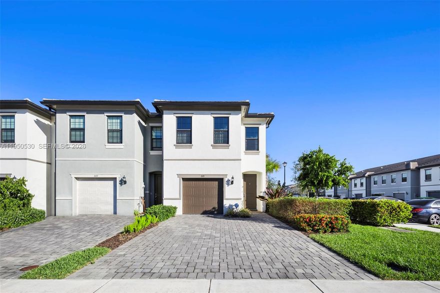 This stunning 3-bed, 2.5-bath corner townhome offers luxury living in a premier gated resort community. The home features an open-concept layout, a Chef’s kitchen, and a spacious master suite with a walk-in closet. High-end upgrades include a Tesla charger, smart home access, and a full Ring security system. Owners enjoy world-class amenities: a pool, clubhouse, pickleball courts, dog park, and workspaces. Perfectly located in Broward County, you are minutes from supermarkets, 6 miles from beaches, and 15 minutes from Las Olas Blvd. This modern, tech-ready home is the perfect blend of comfort and convenience.