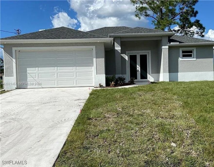 Seller Financing Available. Lease option or lease purchase also available. Welcome to this brand-new home filled with high-end features you won’t find in most new builds. Enjoy 9'4" ceiling height with 8-foot doors and tray ceilings in both the living room and the spacious master suite. The kitchen features 42-inch white shaker cabinets, a food prep island, and quartz countertops with double waterfall edges. Beautiful 24x48 porcelain tile runs throughout the home. Each bedroom has oversized impact windows, and there is a bright eat-in kitchen area. The master suite includes dual walk-in closets and a luxurious bath with an extra-large glass-enclosed shower. The laundry room is located along the hallway leading to the full-sized two-car garage. Double sliding glass doors open to a large covered lanai under the roofline. The exterior features a newly sodded lawn with an automatic sprinkler system and a gutter system to help prevent erosion. This home offers an open floor plan and a fantastic location just 3 minutes from shopping and downtown.