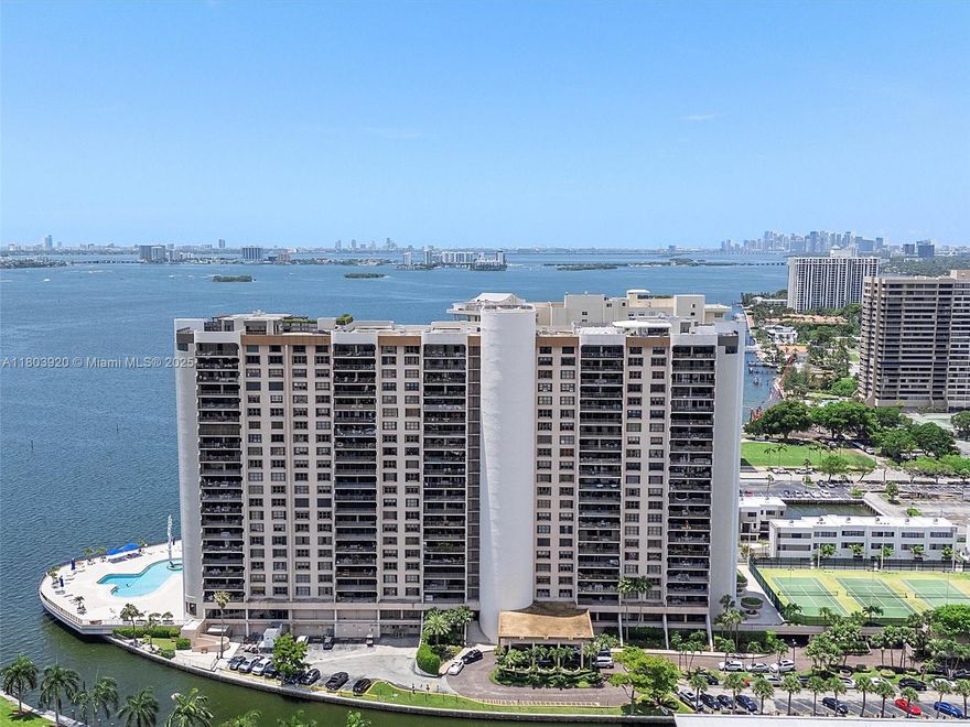 Welcome to this spacious 3 bed, 3 bath condo with nearly 2,000 sq ft and a massive 30' balcony that feels like an outdoor living room. Enjoy panoramic views of the canal, bay, Sans Souci, and all the way to Aventura and Sunny Isles. The open floor plan is filled with natural light and features an open kitchen with solid maple shaker cabinetry, granite countertops, and stainless steel appliances. All three bathrooms are marble, with tile in common areas and wood floors in the bedrooms. Two large walk-in closets, smooth ceilings, and in-unit washer/dryer add convenience. The building is undergoing concrete restoration. The Cricket Club offers top-tier amenities: guard gate, valet, doorman, tennis, basketball, bayfront pool, gym, and lobby bar.