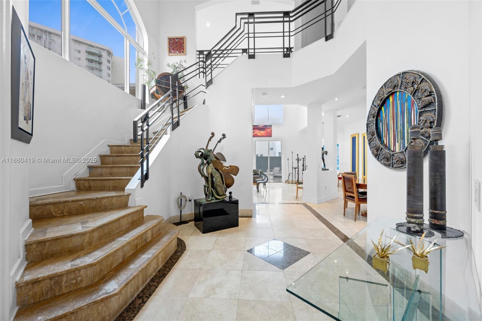 Luxury Living in Sunny Isles Beach! Welcome to this beautifully updated home in the prestigious guard-gated Golden Gate Estates & Marina. Featuring 5 spacious bedrooms and 5.5 bathrooms, this elegant residence boasts newly renovated baths, high ceilings, and designer finishes. The open-concept layout and gourmet kitchen are perfect for entertaining. Step outside to a lush backyard oasis with a fully remodeled pool and spa. Enjoy a two-car garage, laundry room, and access to a private marina, tennis courts and children's playground. Just minutes from world-class shopping, dining, and the beach—coastal living at its finest!
