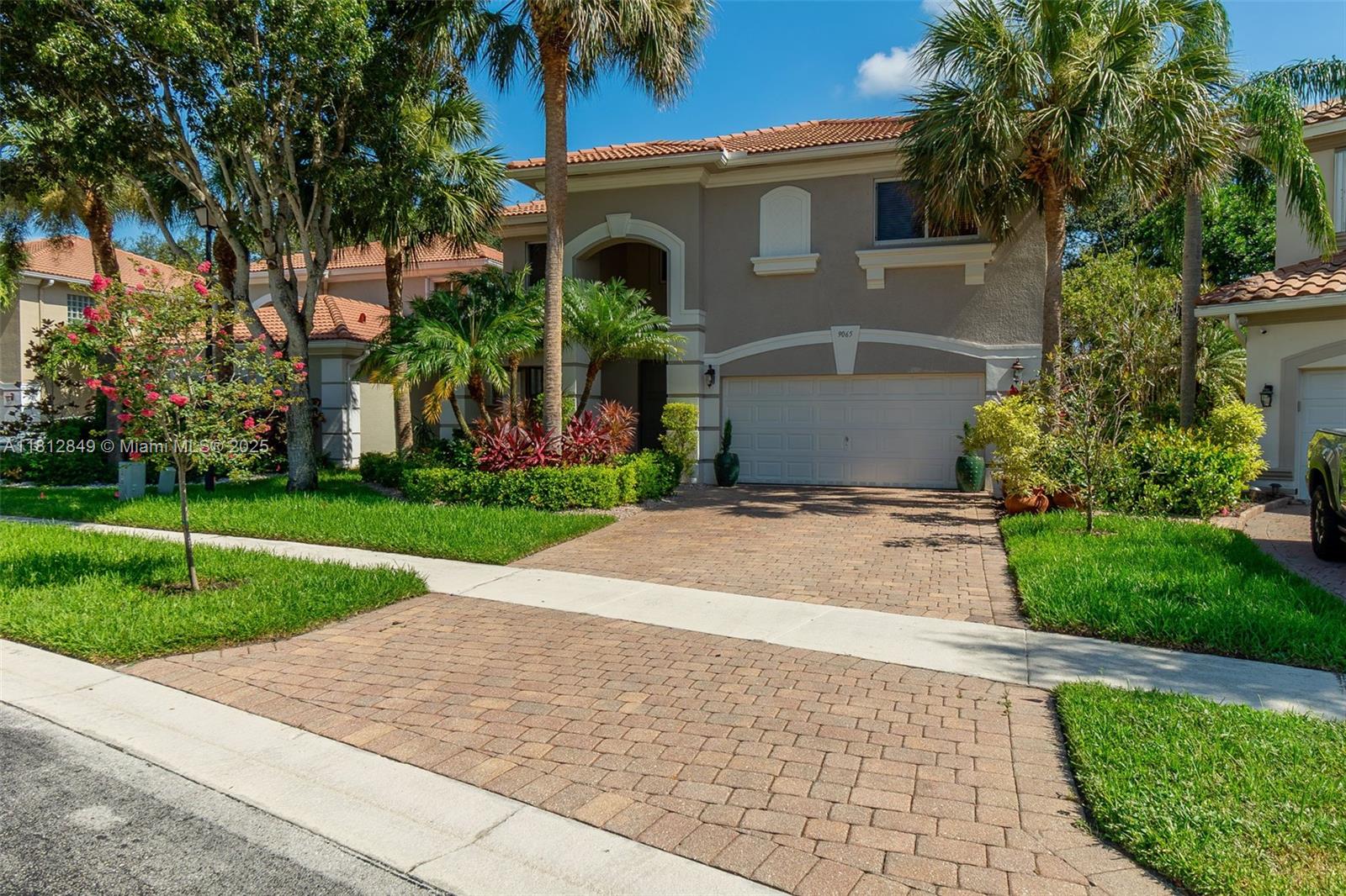 Beautiful child, allergy, and pet friendly home with many upgrades in a cozy gated community. Safety features include full Brinks alarm system and EMT station next door. Five minutes to the Florida Tpke and supermarkets. Walk to top-rated schools, and the community pool and playground are just steps away. Fenced-in patio. Central vacuum and hardwood floors enable our highly allergic family to comfortably own pets. Pet doors to garage and patio. New upgrades include striking first floor bathroom, new appliances, elegant quartz countertops and backsplash, and an economical inverter a/c. Other upgrades include eight inch crown molding, French doors creating two open-concept living spaces, laundry room cabinets, child's murals and tropical fish-themed bathroom, and built-in garage shelves.