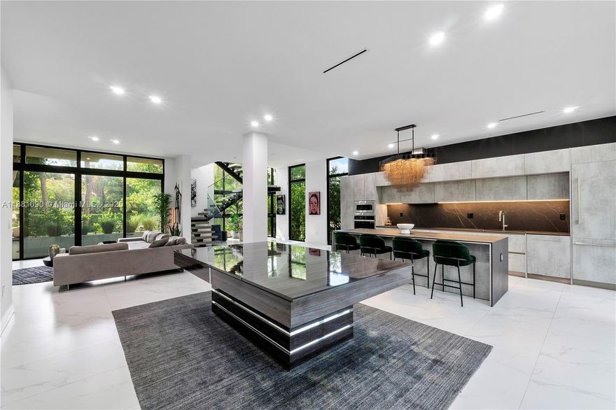 Exceptional 3,000 SF modern two-story residence perfectly blending elegance and comfort. Featuring 4 spacious bedrooms, 3.5 baths, and designer-curated furnishings, this turnkey home offers a seamless move-in experience. Light-filled living spaces flow effortlessly for both entertaining and everyday living. With refined finishes and a sophisticated design, every detail has been thoughtfully considered. Ideally located with a private entrance off 44th St., between prestigious North Bay Rd. and Alton Rd., this home offers both exclusivity and convenience in the heart of Miami Beach. Luxurious custom pool, hot tub with waterfall and firepit in construction, completion date 1/1/26