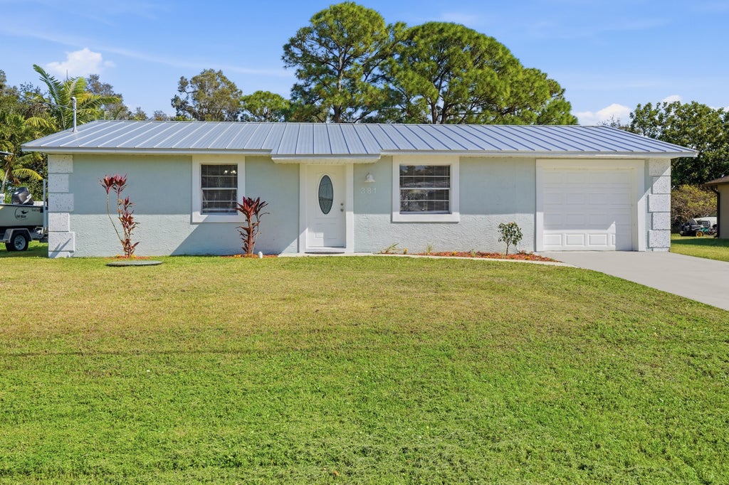 Photo of 381 NW Curtis Street, Port St Lucie, FL 34983 (MLS # R11159130)