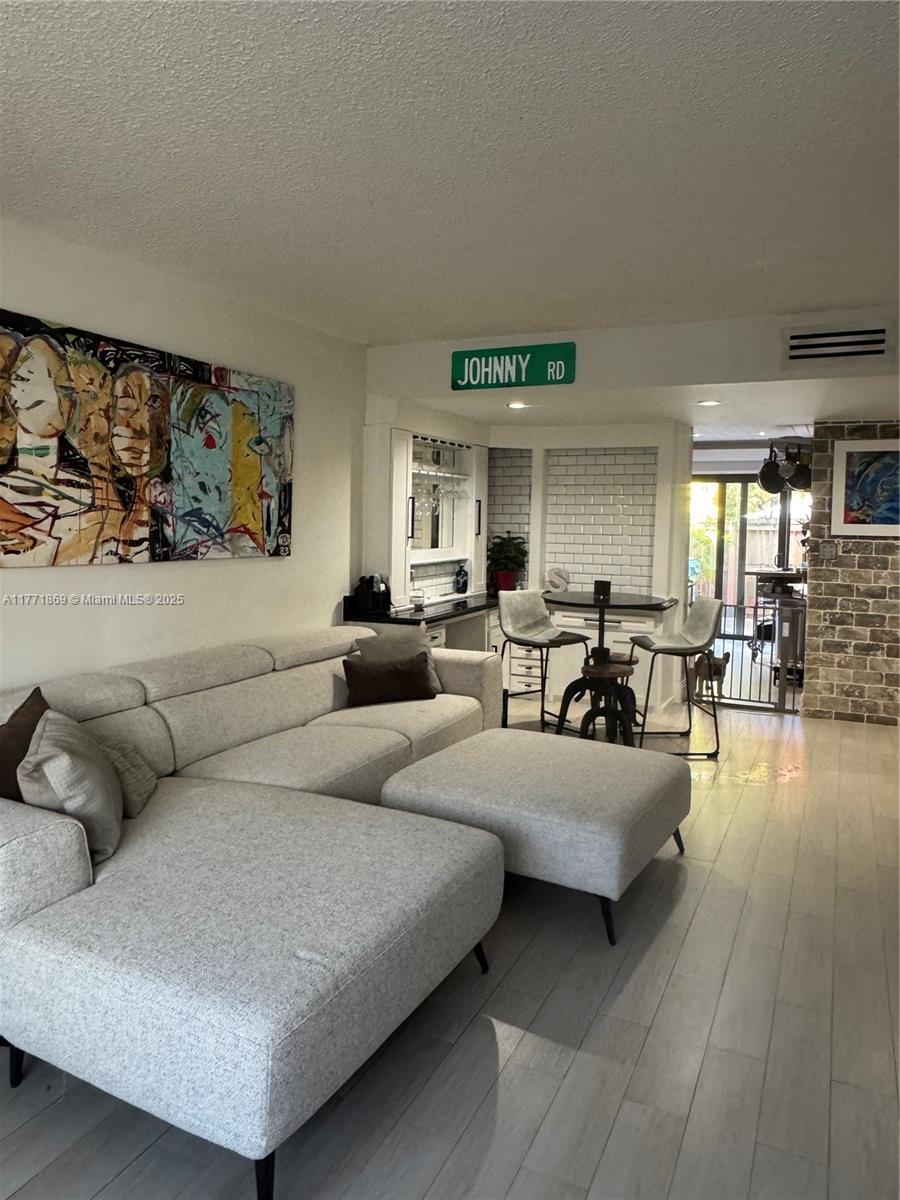 Remodeled Dadeland Cove townhome in gated community. Impact doors and windows. Tile floors on 1st floor, polished concrete floors on 2nd floor, granite counter tops, stainless steel appliances, newer fixtures, newer air conditioner (2023) 24 hr roving security guard. Centralized location, close to Dadeland Mall, Metrorail, Palmetto expressway, US1.