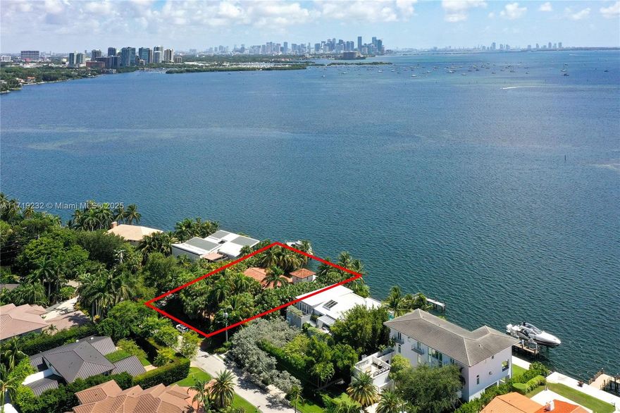 A rare opportunity to build a one-of-a-kind new construction home in Coral Gables overlooking the open water of Biscayne Bay. This is the only lot on the water with such beautiful and unobstructed panoramic views of Coconut Grove, Downtown Miami, and Key Biscayne. This gated community is guarded 24/7. The oversized lot is 16,500 square feet (165 feet deep with 100 feet wide on the waterfront). The current two-story home has four bedrooms and three baths with 4,714 square feet. The pool and the dock are surrounded by lush and beautiful palm trees, as if on an oasis... Worth seeing!
