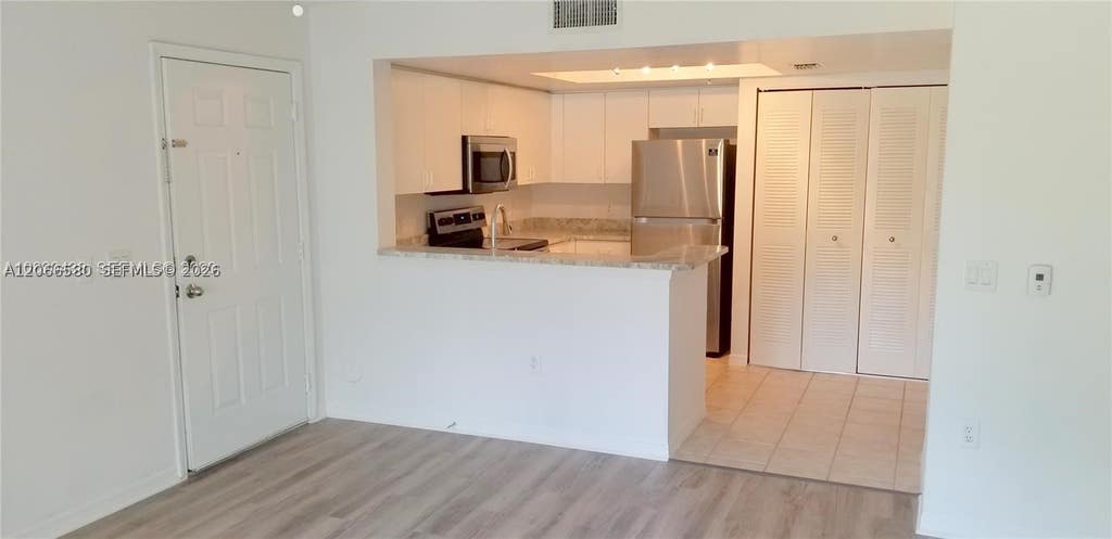 Photo of 4195 N Haverhill Rd #303, West Palm Beach, FL 33417 (MLS # A12066580)