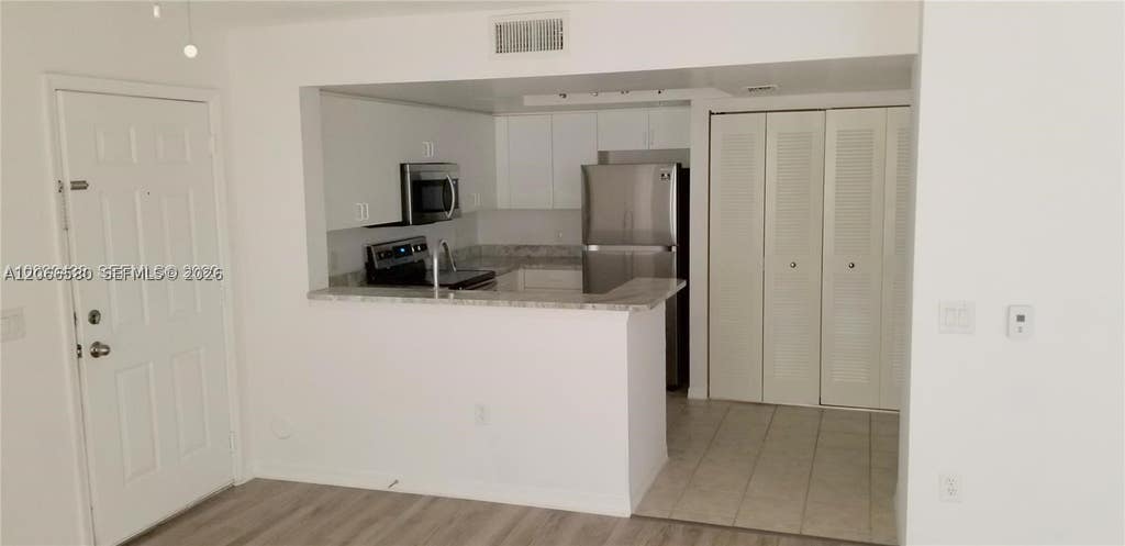 Photo of 4195 N Haverhill Rd #303, West Palm Beach, FL 33417 (MLS # A12066580)