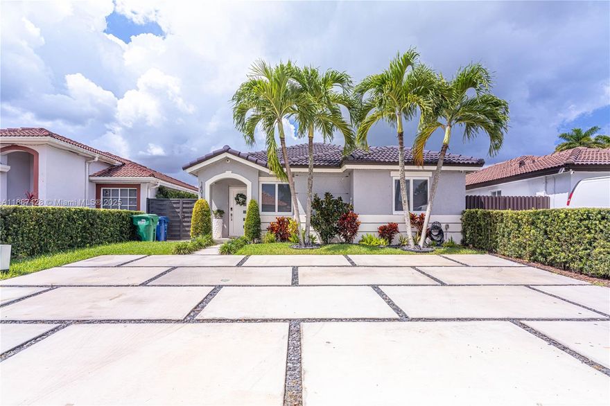 Step into this beautifully renovated home, showcasing a modern kitchen with contemporary appliances, waterfall countertops and stylish finishes, thoughtfully designed for both comfort and functionality. Enjoy year-round peace of mind with impact-resistant windows and doors, offering both security and energy efficiency. Titan tankless water heater for on-demand hot water, a dedicated storage room, and a backyard shed. The home also features a brand-new, gray-tiled terrace adds a sleek modern touch to the outdoor area, perfect for relaxing or entertaining outdoors. A nice cement block driveway provides ample parking space. On the side of the property, a cemented section offers enough space to comfortably fit a small boat or additional storage needs.