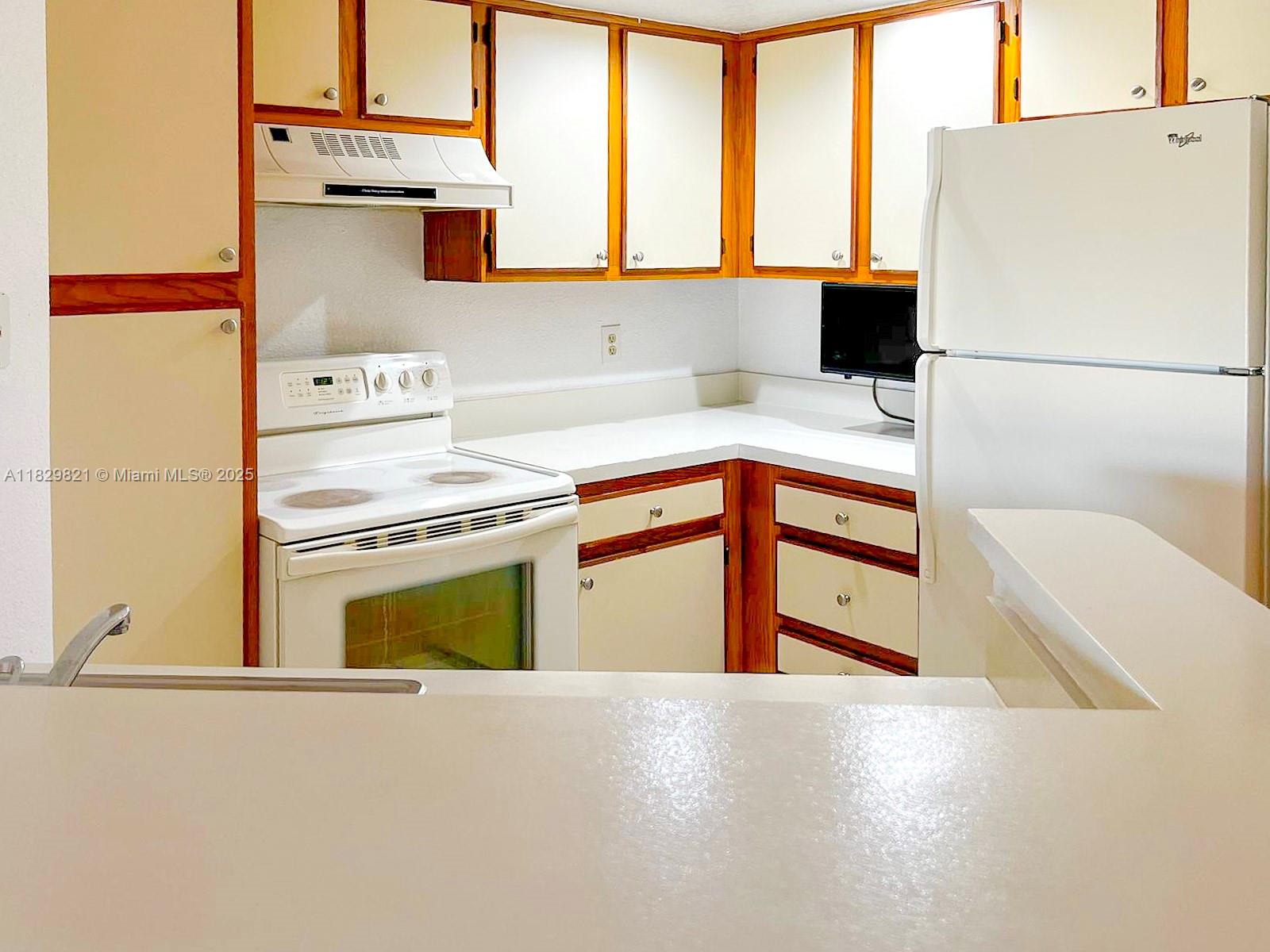 spacious and bright 1-bedroom, 1-bath rental in the desirable Isles at Lago Mar community in Sunrise. This second-floor unit features a comfortable open layout, tile flooring throughout, a large bedroom with walk-in closet, and a private balcony with tranquil garden views. The kitchen offers plenty of cabinet space and white appliances. Enjoy in-unit washer and dryer for added convenience. Resort-style amenities include two pools, gym, tennis courts, racquetball, BBQ area, and clubhouse. Gated community with ample parking. Prime location near Sawgrass Mills Mall, I-75, and major dining and entertainment. Ready for immediate move-in!