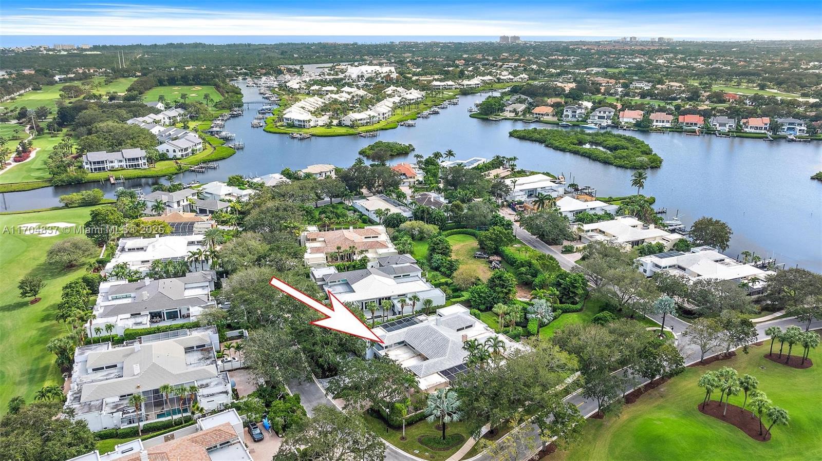 Welcome to your dream Villa in Admirals Cove! This stunning courtyard residence boasts sophisticated upgrades with a sleek and contemporary flair. The intimate and private pool area is perfect for relaxing or entertaining, while the separate guest house offers privacy and comfort for your visitors. The private backyard and gardens create a serene oasis, ideal for enjoying Florida's beautiful weather. With its modern lines and luxurious finishes, this home is a true masterpiece of design and elegance.