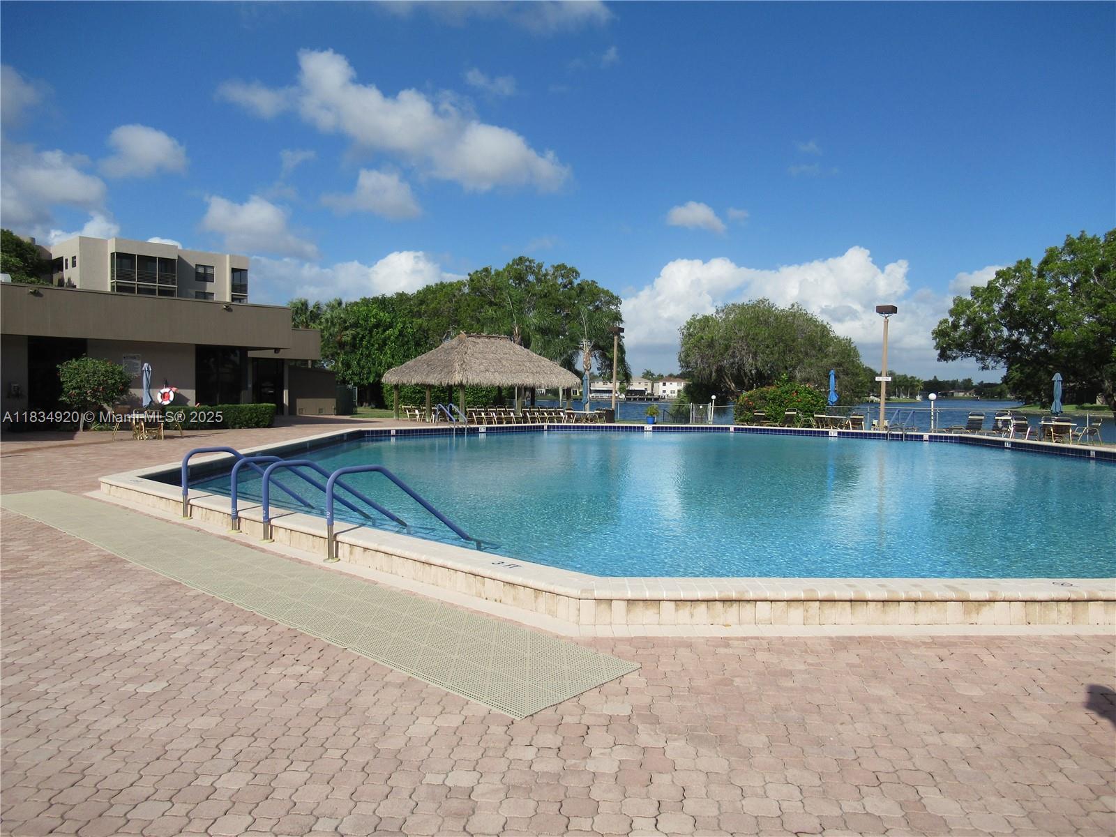 MOTIVATED SELLER Charming 1-bedroom, 1.5-bath condo in a desirable 55+ gated community in Pembroke Pines. This second-floor unit features serene lake views, washer and dryer, hurricane shutters, and elevator access. Enjoy resort-style amenities including a clubhouse, pool, jacuzzi, tennis, racquetball, billiards, and a courtesy bus. HOA includes water, cable, and internet. Association approval required. No leasing allowed. MOTIVATED SELLER—schedule your showing today!