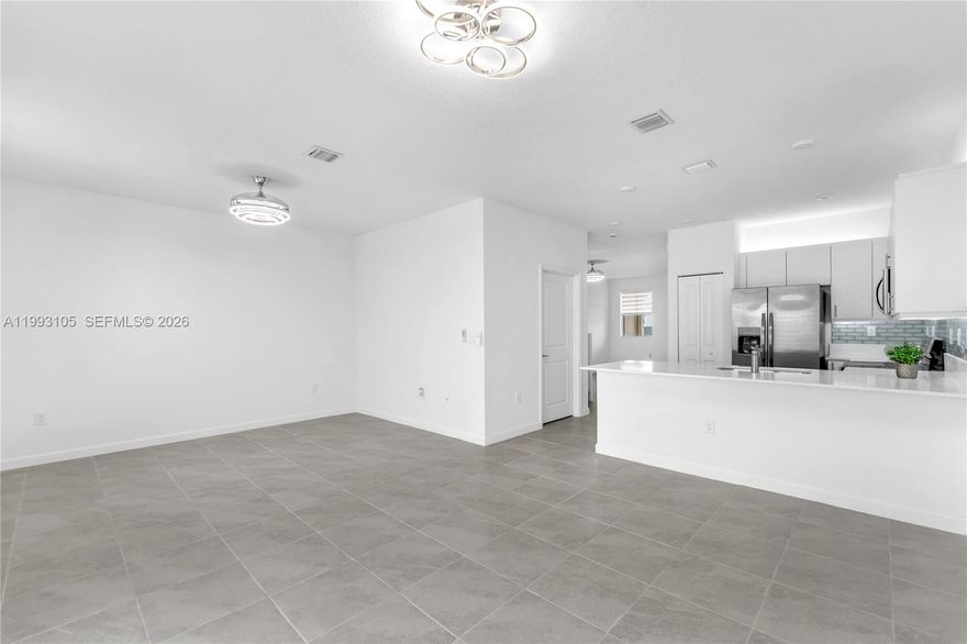 Fully Updated NEW 3/2.5 townhouse featuring a garage and a beautifully paved backyard for maintenance-free living. This home is loaded with upgrades: zebra blinds, washer/dryer, modern light fixtures and fans, a water filter, garage door opener, and modern bathroom mirrors. Enjoy custom closets equipped with a rotating rack for shoes and handbags, plus illuminated kitchen cabinets with a sleek backsplash. No detail was overlooked—this home is move-in READY! Altamira is a master-planned community offering premium amenities including a golf course, pickleball, swimming pool, tennis, a ballroom, and much more. Section 8 Welcomed