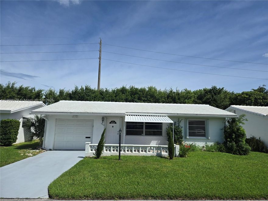 Completely renovated beautiful home with spacious back views to a lagoon. This Fairmont model is two bedrooms two bathrooms with spacious closets. Both bathrooms have been remodeled with a fresh style. It also comes with accordion shutters and Hurricane rated Panel over front porch. Backyard has lots of privacy with gives access to the pond. Paid up recreation in full. Low HOAt that offers pressure washing the property every two years and painting the property every four years, landscaping, an 18 Hole Par 3 Golf course plus 3 active clubhouses with 3 heated pools with saunas and much more. Minutes to Ocean beaches, shopping and restaurants. Vacant for quick close. A Must See.