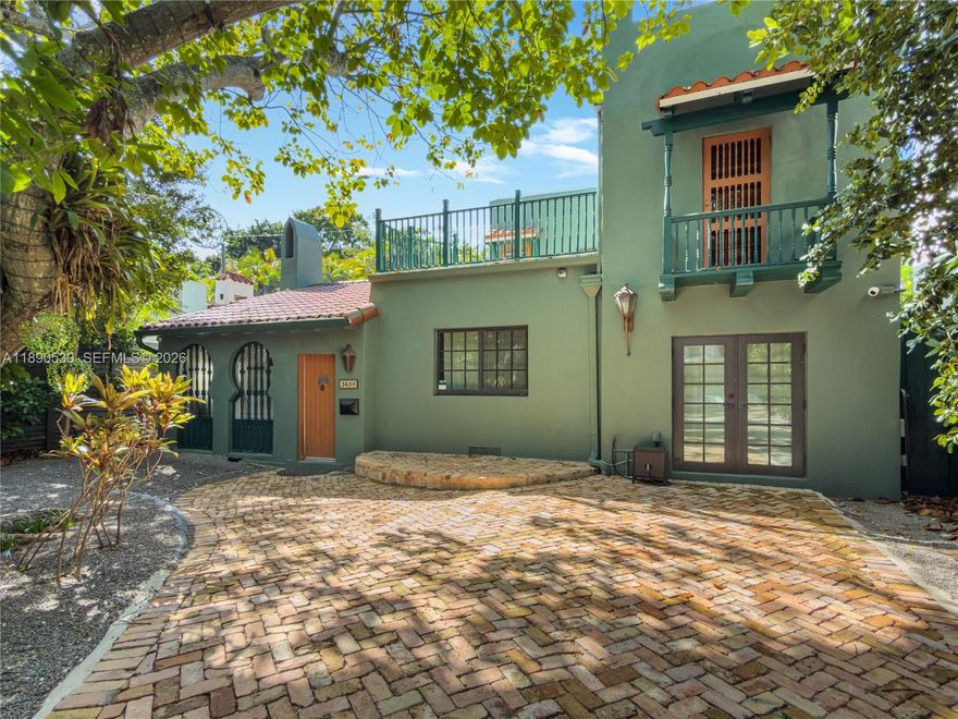 Welcome to Casa Bohemia! Tucked beneath the lush tree canopy of South Coconut Grove, this beautifully renovated Mediterranean gem sits on exclusive N Bay Homes Drive, a rarely available street offering a setting that feels both intimate and timeless. This captivating home features charming original architectural details, from arched windows and French doors to exposed beams and textured accents that blend enduring character with modern flair. Thoughtfully reimagined, the renovation celebrates the home’s design and craftsmanship while introducing contemporary comforts, creating spaces that feel both inviting, effortlessly livable, and truly move-in ready.

Step into the living room, where a soaring vaulted ceiling and cozy fireplace command attention, inviting gatherings that linger long into the evening. Impact sliding doors open to a serene private terrace and heated pool, surrounded by lush tropical greenery beneath the Grove’s iconic tree canopy, giving the street an almost European feel with very low traffic and exceptional privacy. Ideally situated in a non-flood zone, the home offers easy walkability or a quick golf cart ride to the Village center, along with convenient access to Douglas Road, the airport, and LeJeune, proximity to top rated schools, and energy efficient living.

A distinctive opportunity in one of Coconut Grove’s most coveted settings.