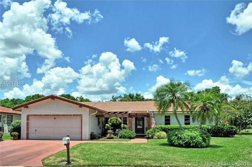 Beautiful 1 story home with lush landscaping on an oversized pie shaped lot,  3 bedrooms, 2 full baths, Family room, 2 car garage, new kitchen with granite counter tops and SS appliances, updated baths, wood floors, impact windows, covered screened patio, cabana bath access to oversized pool, very private fenced yard, gutters and leaders, on a quite cul-de-sac block. NO HOA