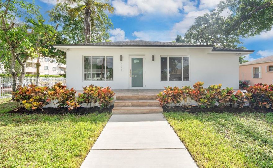 Investment opportunity to live and rent! Beautiful home with 3 bedrooms, 2.5 baths and 2 independent apartments of 1 bedroom with kitchen and living room area. Each apartment has an independent entrance and gated parking with lots of garden space. Large corner lot in prime centric location. Property was fully redone with city permits and inspections. Everything was redone including all property electrical, plumbing, roof, hurricane windows, structural, air conditioning, fence, etc. ALL LEGAL AND WITH CITY PERMITS, including both in- laws additions. High end finishes, European kitchen cabinets, quartz countertops, porcelain flooring, stainless steel appliances.  Ready to move in and rent. Easy to show!