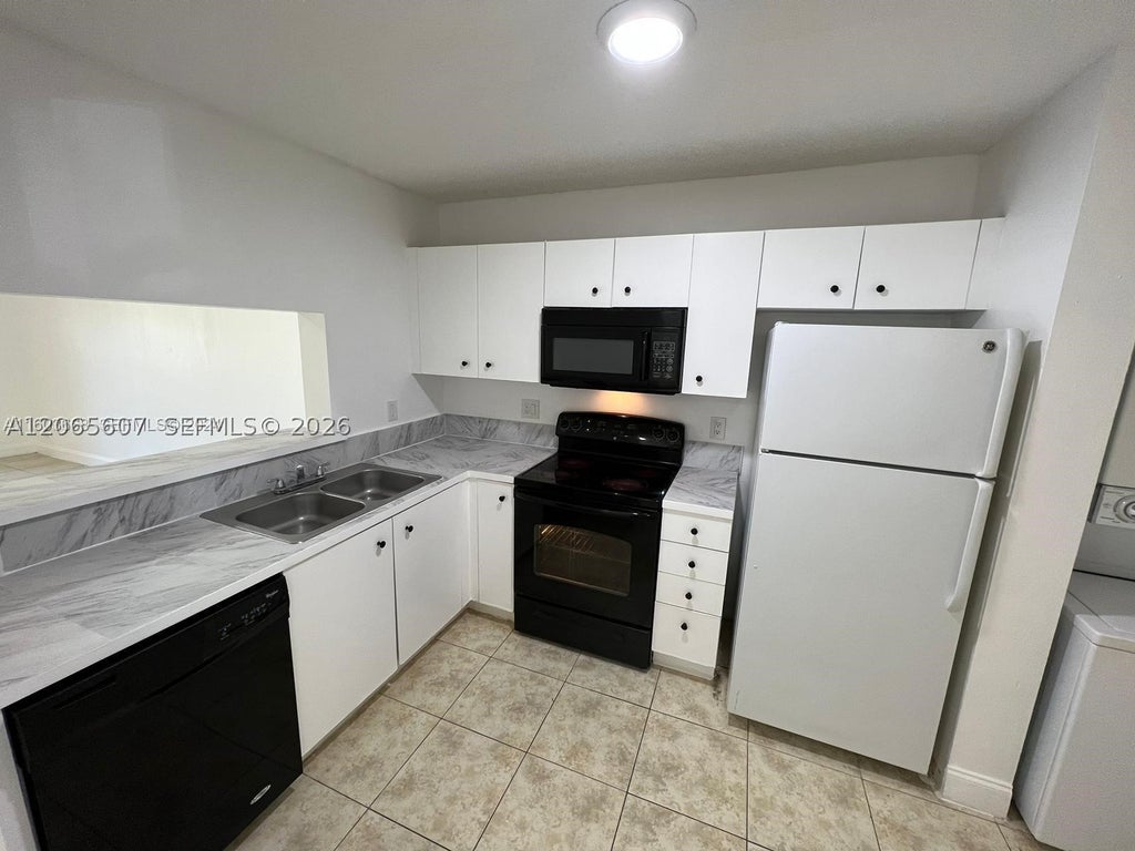 Photo of 2421 NW 56th Ave #2-103, Lauderhill, FL 33313 (MLS # A12065607)