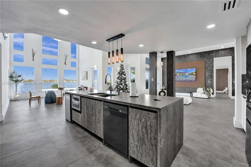 Modern & fully furnished by Dejavu Development in the exclusive one way, HARBOUR LAKE ESTATES. NEW impact windows & doors, new ac units, heated pool, boasting 85ft waterfront and stunning panoramas. Meticulously designed with premium materials, soaring ceilings, expansive living areas, and exquisite designer furnishings exuding sophistication. Every detail exudes opulence - from the pivot entry door to Spanish porcelain floors, venetian walls, and facade wood slats. NEW gourmet chef's kitchen features top-tier appliances, Italian waterfall quartz, & more. Entertainer's dream, large pool, seating within and sunbathing lounges, a sunken firepit, and endless sunset vistas, and beach area. This residence is an embodiment of luxury that demands to be experienced firsthand!" Seller financing!