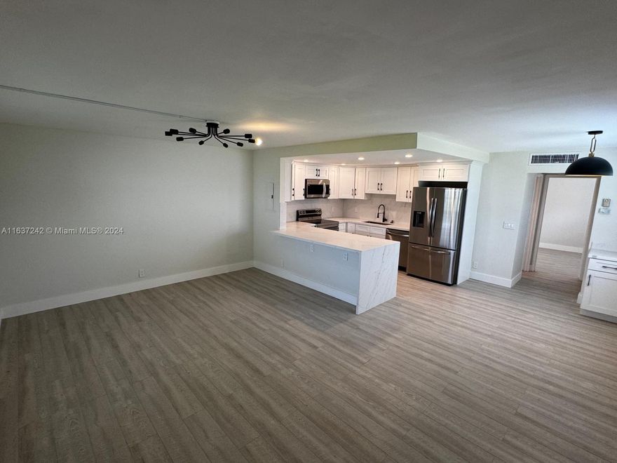 Fully Renovated and updated first floor unit in gated Delray Beach community! Condo is turnkey with a brand new kitchen, all new stainless steel appliances and high quality custom wood cabinets. Beautiful Calcutta countertops featured in both the updated open concept kitchen and bathrooms. 55+ Resort Style Amenities: 3 Clubhouses, 5 Pools, Auditorium shows, golf course, pickleball, tennis, racquetball, clubs, etc.