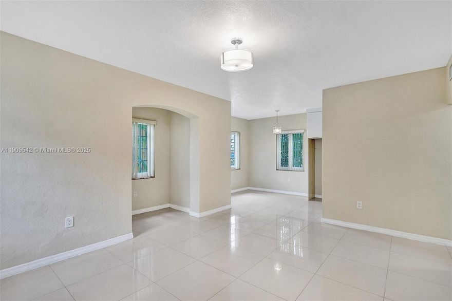 Striking apartment home with water views in a Mediterranean style building.  Completely renovated with updated kitchen, fairly new a/c and appliances.  Porcelain floors, impact windows, office area, great closet space.  South Florida living 5 minutes from the white sands of the Atlantic, near shopping, public transportation.  Secure gated building with lush open spaces between units for maximum privacy.