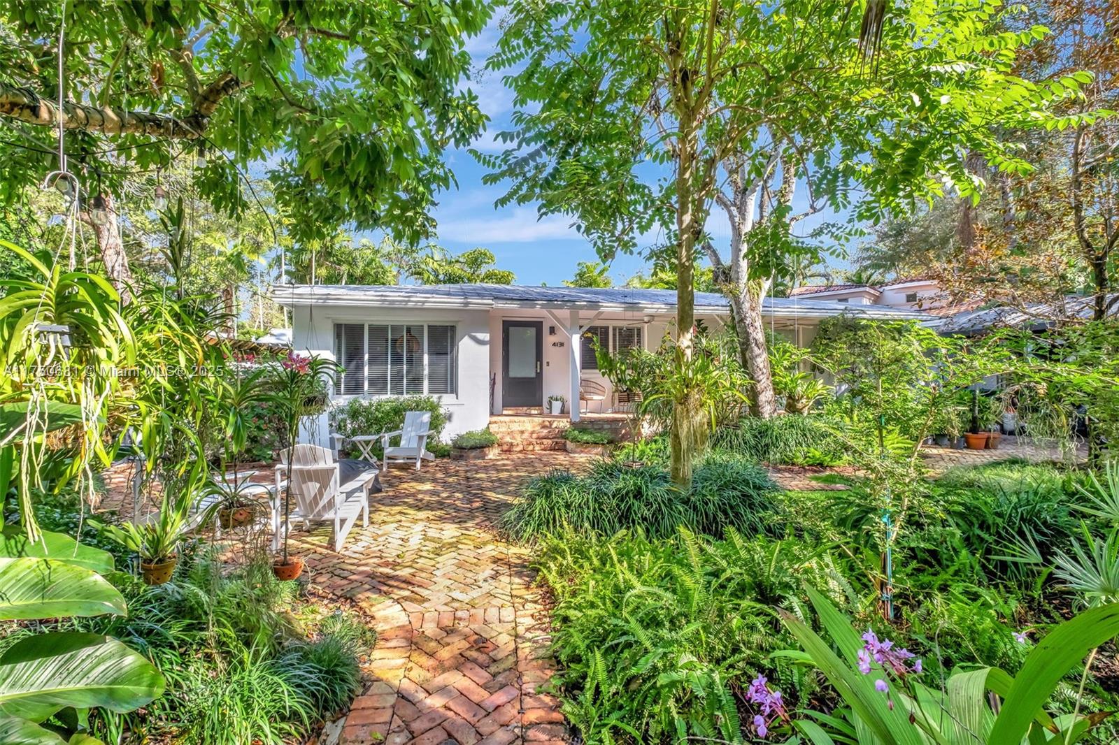 Welcome to 4131 Lybyer Ave, a charming residence in Coconut Grove's sought-after Sunshine Vistas. This home offers a perfect blend of classic charm and modern updates. Old Chicago brick graces the front patio and walkway, creating an inviting curb appeal. The beautifully remodeled kitchen boasts top-of-the-line appliances: Thermador gas range, Miele smart coffee system, and more. Relax in the expansive primary suite, featuring vaulted ceilings, a private A/C, entrance, and patio. Enjoy a dip in the refreshing saline pool. Peace of mind comes standard with a metal roof and impact-resistant windows and doors. Experience the vibrant Coconut Grove lifestyle, with easy access to world-class shops and dining. Check the 3D Virtual tour for more details! Must see!