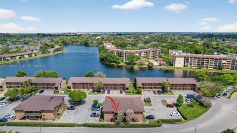 Photo of 10002 Winding Lake Rd #204, Sunrise, FL 33351 (MLS # A11991426)