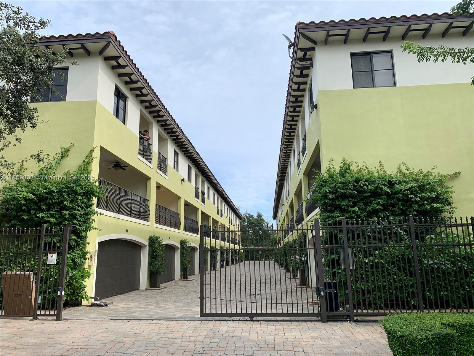 Beautiful tri level townhome 2 bed+den/2 full bath/2 half bath at the exclusive Grove Villas, a gated community in the heart of Coconut Grove. It features 2 bedrooms with enclosed baths on the 3rd floor with private balconies; a living/kitchen/dining area with 2 balconies and a half bath on the 2nd floor; a room on the 1st floor that can be used as an office, family room or guest room, a half bath, a 2-car garage, and large and private patio area. The property, including the garage has just been freshly painted. Amazing location: minutes to Coconut Grove's restaurants, farmer's market, entertainment and shops. It is very close from the Douglas Metro station, next to Miliam's Market and Home Depot Make this your home.