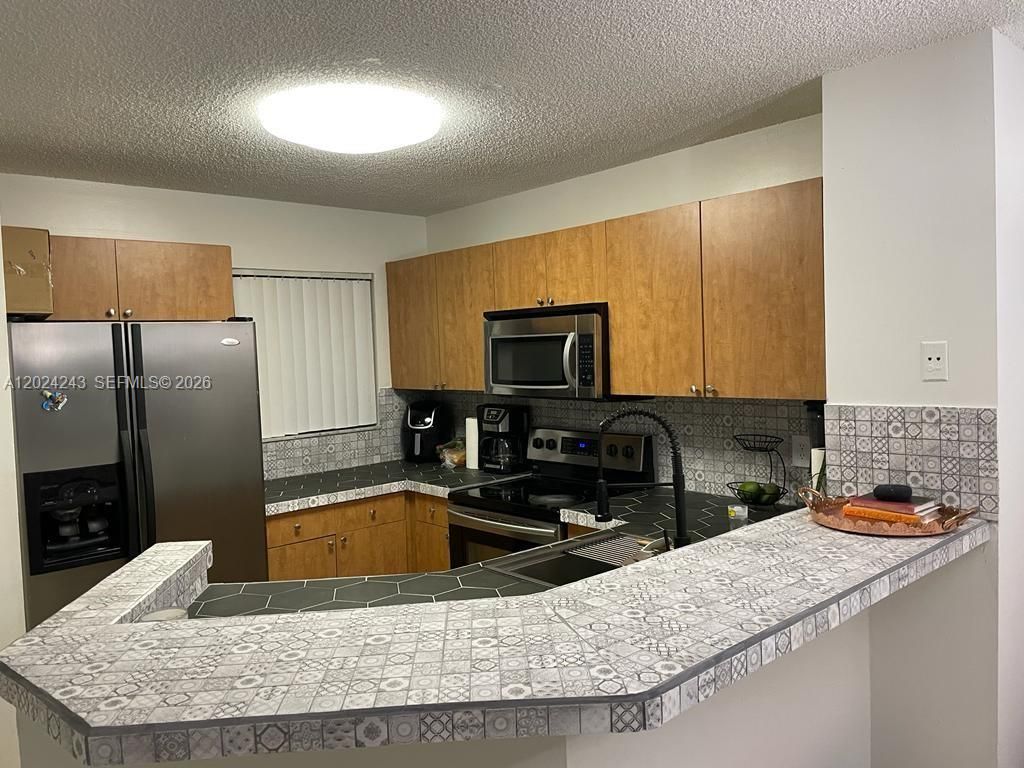 Photo of 8750 N Sherman Cir #208, Miramar, FL 33025 (MLS # A12024243)
