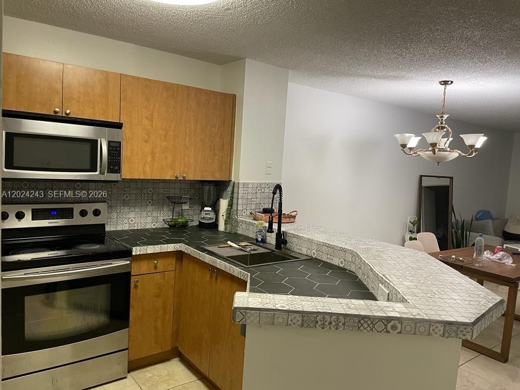 Photo of 8750 N Sherman Cir #208, Miramar, FL 33025 (MLS # A12024243)