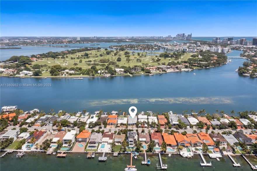 WIDE BAYFRONT residence w/ beautiful Indian Creek Island views. Recently renovated & premier 
Northern location. 24/7gated community on a quiet cul-de-sac Rd. Featuring all new tiled roof, high impact resistant windows & doors & contemporary kitchen with Quartz countertops. Open floor plan, expansive water views, w/large Master Bedroom + Bath & spacious walk in closet. Spectacular pool & patio w/great boat dockage including 2 boat lifts on deep water with easy ocean access. Prime location- minutes to beaches, shopping, schools & transportation. Owner financing is possible. Real Seller