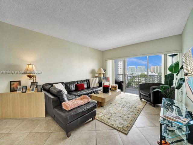 Spacious Corner Unit with wrap around balcony emcompassing skyline and water views. Largest unit in Arlen House with 1350 sq.ft of living space and lots of storage. The kitchen has an eat in area as well as a nice size dining room. The living/family room is cozy. The bedrooms are ample size with good closets. The building is in front of the beach offering many amenities including a fitness center, game room, library, business center, market place, sauna and more. The unit comes with an assigned parking space and storage unit on the same floor. There is a courtesy bus and this is a 24 hour gated community. A full service building.