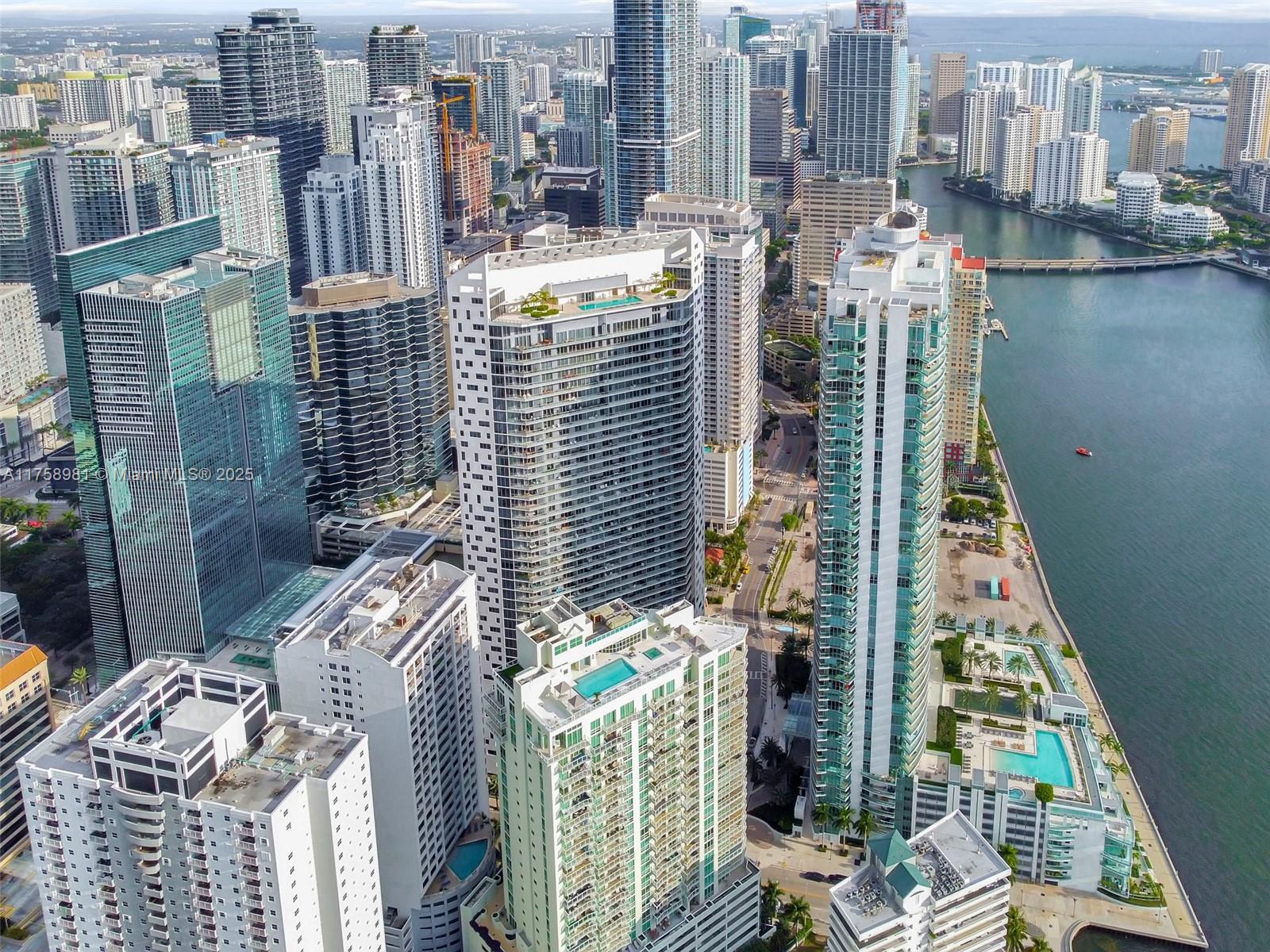 Step into luxury at Brickell House with this stunning 2-bedroom, 2-bathroom waterfront residence offering breathtaking ocean and bay views. Floor-to-ceiling windows flood the spacious living area with natural light, highlighting the sleek contemporary design and elegant furnishings. The modern kitchen has top-of-the-line appliances, perfect for cooking and entertaining. Both bedrooms provide a peaceful retreat, with the primary suite featuring spectacular water views and a spa-like en-suite bathroom with high-end finishes. Residents enjoy world-class amenities, including two pools, one of which is an expansive 46th-floor sky deck with panoramic city views a state-of-the-art gym, a spa, and steam rooms. Experience the best of Miami luxury living in this exceptional home.