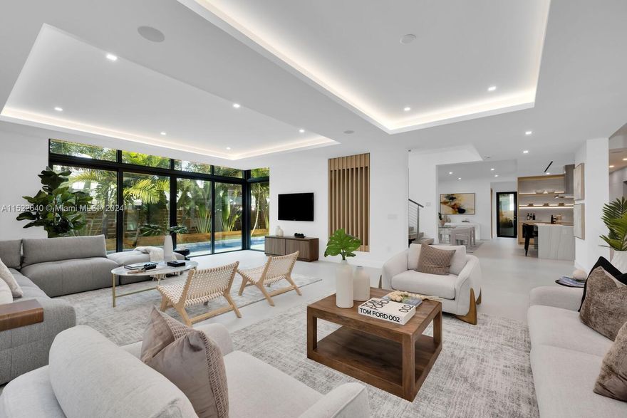 Captivating, new construction Coastal Contemporary home in prestigious North Coconut Grove. Built by premier custom home builder- HB Construction. 5BR/6BA. Light-filled living spaces feature volume ceilings, floating staircase, custom built-ins & porcelain tile flooring. 1st level w/ formal living/dining & family room + full guest suite. Stunning European-style kitchen offers sleek cabinetry, Subzero/Wolf appliances & cooking island. 2nd level has white oak wood flooring & 4 additional bedrooms (all ensuite) including primary suite w/balcony, custom walk-in closet and spa-like bath featuring glass-enclosed shower & soaking tub. Enjoy the tropical outdoor retreat w/covered terrace, built-in grill & tranquil pool. Minutes to the Grove village, MIA, downtown & the Beaches.