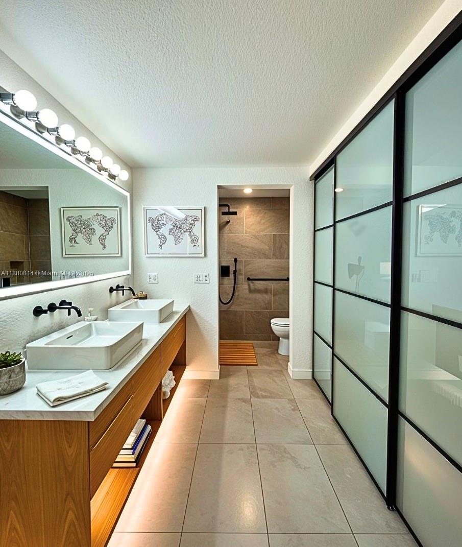 Spacious 2BR/2BA condo with full renovation potential in prime location just off I-95—between Downtown Miami & Fort Lauderdale, near Bright-line & Hard Rock Stadium. Offers 1,253 sq ft (per records) and approx. 1,325 sq ft (floor plan). Priced to reflect as-is condition with room to build equity. Photos begin with vision board-style renderings to help you see the transformation possibilities. Unit features a walk in closet, and spacious second closet, with plenty of storage space. Ideal for buyers who want that "first-to-live-here" feeling — this unit offers a clean slate to design your dream space from the ground up. No rentals for the first year of ownership. Motivated seller—bring your vision, ALL OFFERS WILL BE CONSIDERED!