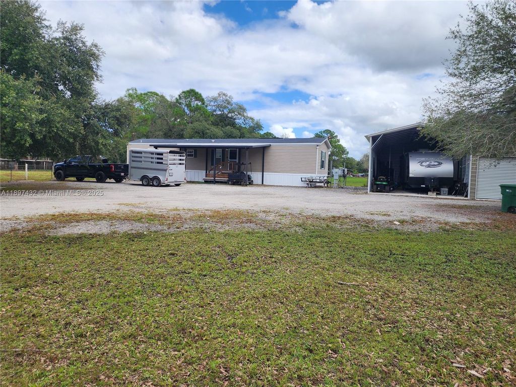 Photo of 303 Horse Club Ave, Clewiston, FL 33440 (MLS # A11897432)