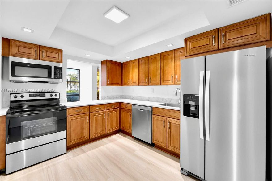 TOP WATERFRONT LOCATION! This FIRST FLOOR unit lives like a HOME - SPACIOUS BEDROOM, 2 FULL BATHS plus a DEN perfect as a 2ND BEDROOM, OFFICE, or FLEX SPACE. REMODELED property includes refined LIGHT FIXTURES, FLOOR-TO-CEILING WINDOWS, ENGINEERED WOOD & TILE FLOORS, and a CUSTOM WALK-IN CLOSET. Bright and airy EAT-IN kitchen with NEWER STAINLESS STEEL APPLIANCES and generous COUNTER SPACE. LOW MONTHLY FEES include HOTWIRE TV/INTERNET, HOT WATER, and 24HR SECURITY. Enjoy RESORT-STYLE AMENITIES: intracoastal front pool & sun deck, waterfront tennis courts, modern fitness rooms, BBQ area, clubroom, shuffleboard & billiards. INVESTORS WELCOME—RENT IMMEDIATELY! THREE ISLANDS is a GATED COMMUNITY with parks & playground, minutes to the BEACH, dining, Gulfstream Park, Aventura Mall & Airports.