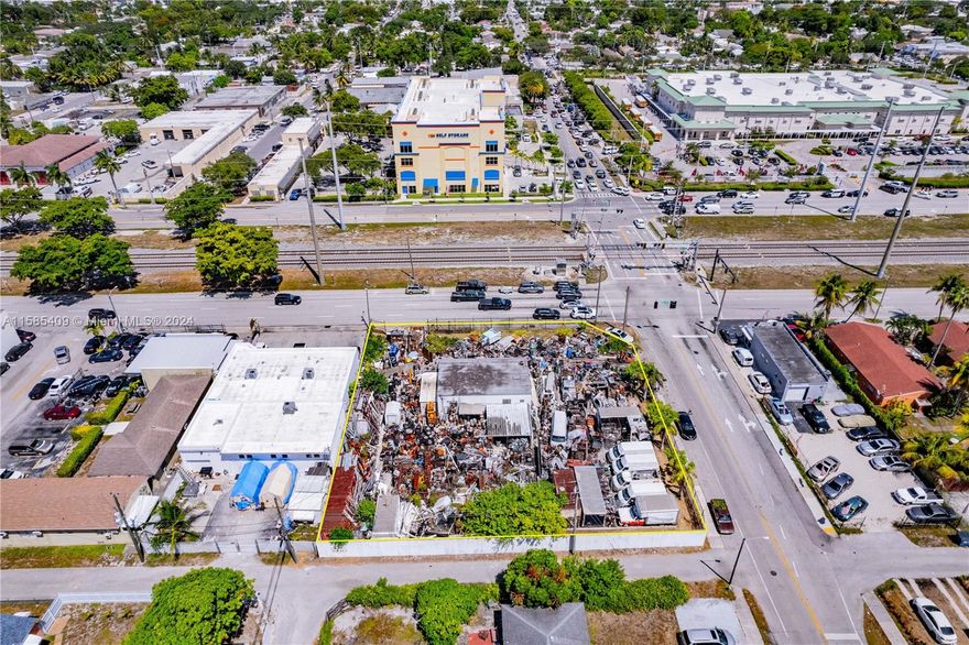 Excellent location on the corner of N. Dixie HWY & Taft ST. Lot totals approximately 1/2 acre (21,261SF); with great frontage space, on both N. Dixie HWY & Taft ST, totaling approx. 142 ft & 150 ft, respectively. Zoned DH-3; presents significant opportunities for development, with comparable parcels having secured approval for 10-story buildings housing 70+/- units. Suitable for a variety Commercial & Residential purposes.
Currently, enclosed with an 8 ft high concrete wall on the north and west side of the property; the remainder portion is enclosed by chain-link fence/gates. In addition, there is an enclosed back lot area; isolating it from the general parking. The building was renovated with improvements consisting of impact windows and doors, drainage system, parking and paving.