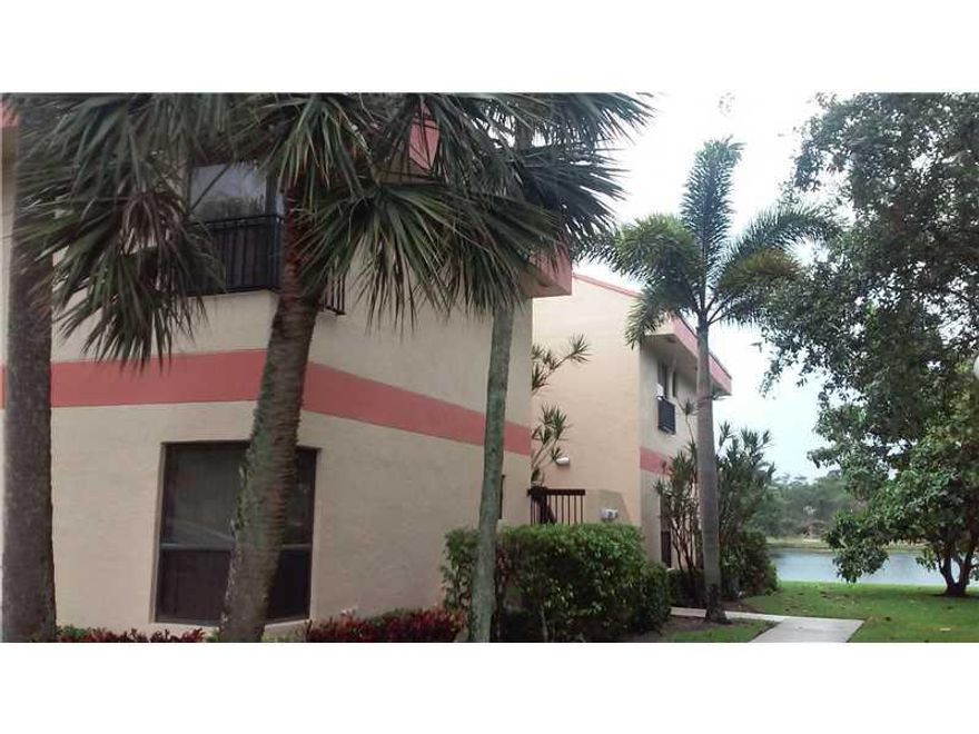 All ages. Show and sale, ready to move in spacious 2/2 with enclosed air conditioned balcony patio, new tiles, open kitchen, newer appliances, new electrical, full size washer/dryer, extra attic space, plenty parking, heated pool, gym, theater, tennis cou rts and much more. Easy showing on lock box. Association requires 15% down and 30 days approval. Just call agent to show.