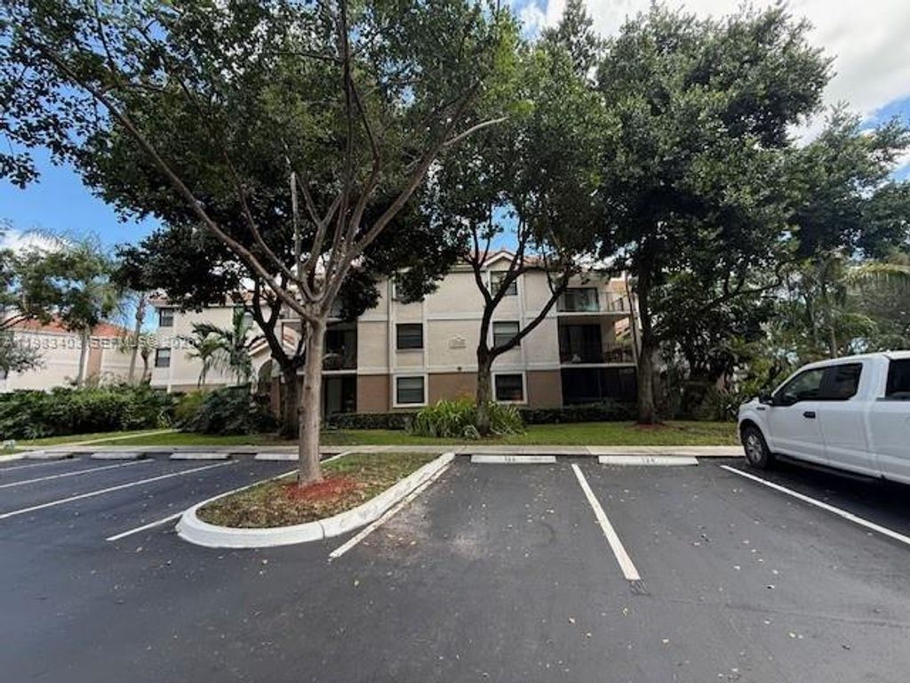 Photo of 10161 W Sunrise Blvd #104, Plantation, FL 33322 (MLS # A11983403)