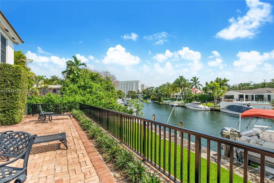 First time ever offered. A rare waterfront opportunity in Coral Gables now presented as 2 separate condominium residences. Unit A, downstairs residence, offers bright interiors & direct access to the property’s 80 FT boat dock (40 FT assigned to this unit) along a beautiful Gables waterway. Walls of windows & a sunroom frame tranquil water views while opening to a gorgeous private patio ideal for outdoor dining & entertaining. The well-designed floor plan includes an ample living room, separate dining room, & large eat-in kitchen w/granite counters, stainless appliances & counter seating that opens to the family room. This substantially updated residence features 2 large bedroom suites w/2 private baths plus a powder room, porcelain tile floors throughout, plantation shutters & abundant closet space. Additional features: an indoor laundry room w/full-size washer & dryer & space for an additional refrigerator/freezer, an exterior walk-in storage closet, & three exterior parking spaces. A charming walled courtyard entry welcomes you to this impeccably maintained property owned by only one family. New roof March 2025. Unit A is offered at $3.2M & includes 40 FT of dockage. Unit B (MLS #A11973154) is also available. Both units may be purchased together for $5.8M creating a rare waterfront compound w/ 80 FT of total dockage.