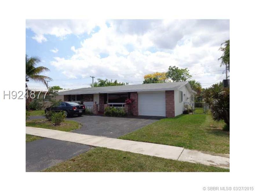 3 bedroom 2 bath 1 car garage.  Located on quiet street, central to all frequently used amenities as well as I-95 and Turnpike.  New Hurricane impact windows, newer ac, roof, features a split bedroom plan.Large florida room with huge open view to backyard , also, a permitted enclosed den.  Great layout,  Best value in the area. Can move in and start living or do upgrades in kitchen. Sold As-IS