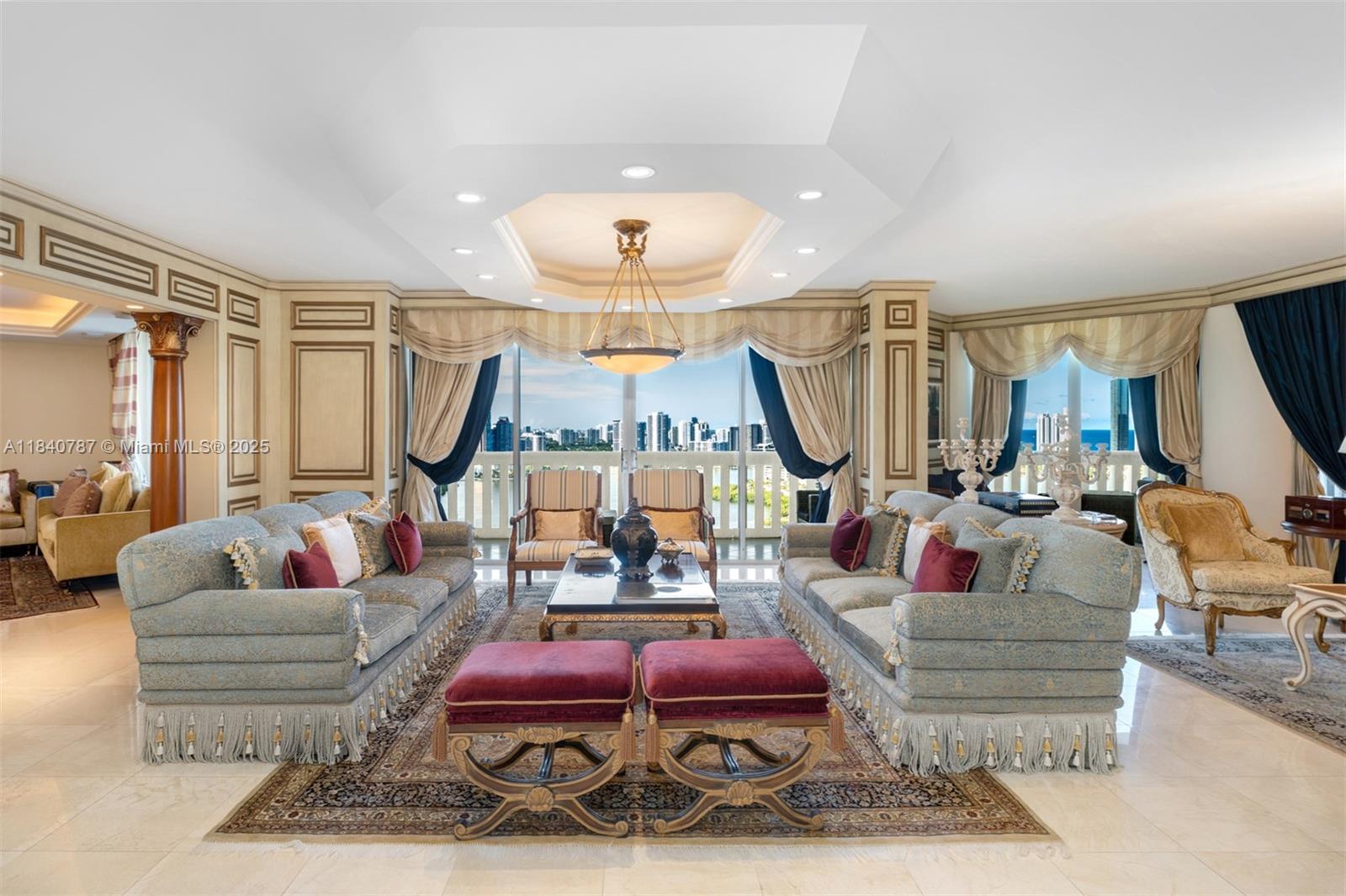 Experience elevated living in this fully furnished 5-bed, 6.5-bath sky residence on the 29th floor of the prestigious Williams Island. Unit 2902 boasts breathtaking panoramic views of the Intracoastal Waterway, Atlantic Ocean, and city skyline from floor-to-ceiling windows and a spacious private balcony perfect for enjoying sunrise coffee or sunset cocktails. This impeccably maintained home is offered fully furnished with elegant, classic décor, and custom upholstered seating. Ready for move-in. The open-concept layout is light-filled and expansive, generous closet space. Located in the 3000 Building, resort-style amenities such fitness center, valet, concierge, pool, tennis courts, and access to the Williams Island Club, which features a 27,000 sq ft spa, marina, fine dining, and more.
