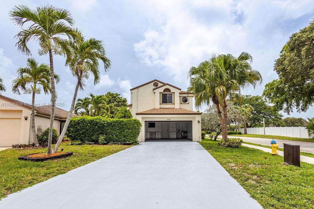 Spacious 5-bed, 2.5-bath home on a large corner lot in Coconut Creek. Updated kitchen with stainless steel appliances, granite counters, open living/dining areas, and versatile den. Master suite offers walk-in closet. Backyard is fully enclosed with a brand new 6 ft white vinyl fence installed two months ago,Shutters, featuring two gates—front and back by the lake. Enjoy lake access for canoeing, kayaking, and fishing. The garage is anyone’s dream, with white shaker cabinets, workbench, and a closet/shed inside the oversized 2-car garage. Driveway fits 6 cars. Paid-off solar panels reduce utility costs. In-unit laundry, cable and internet included. Centura Parc amenities: pool, gym, and sports courts. This corner property has it all—come see, this awesome corner lakeview home won’t last!