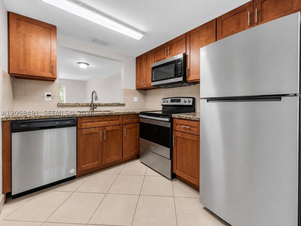 Photo of 3821 NW 90th Ave #3821, Sunrise, FL 33351 (MLS # A12058491)