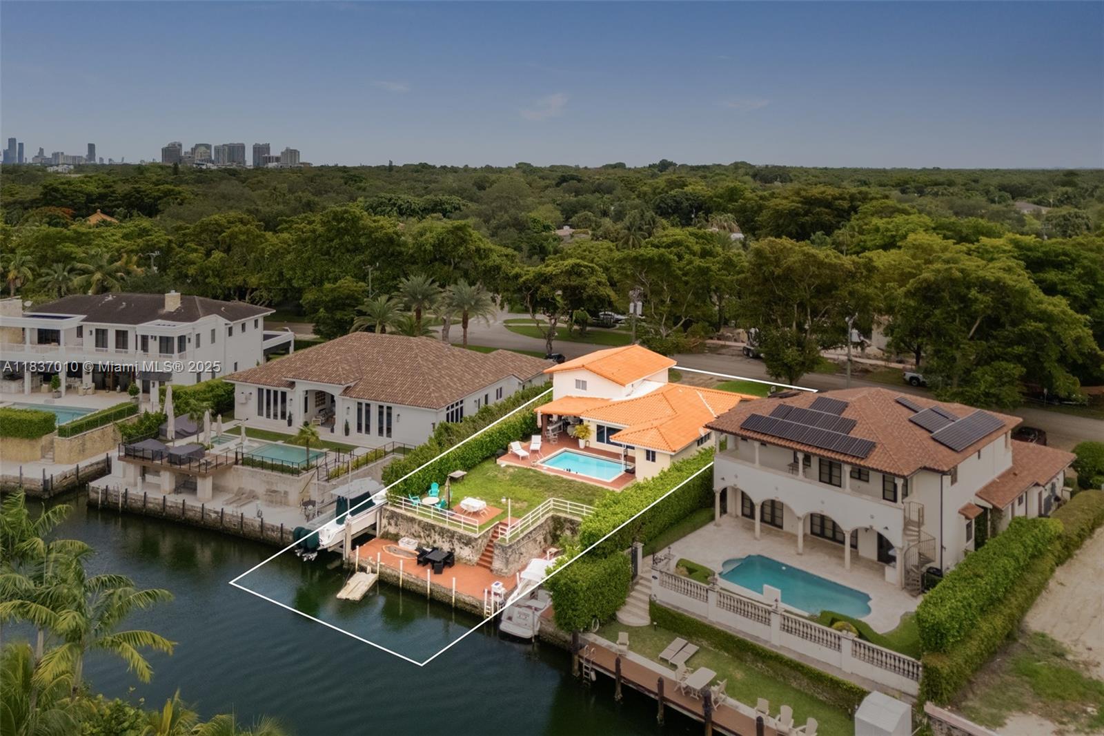 Live the dream on the Coral Gables Waterway! Enjoy the ultimate in waterfront living, ideally located on prestigious Riviera Drive & just minutes from the bay. A true boater’s paradise w/ 67’ on the water, private dock & coral rock-carved boat slip, w/ only 2 high bridges to the open water. This natural hurricane-protected harbor is one of the few places in SoFla where you can enjoy waterfront living & rare elevation above the flood zone- offering both peace of mind & direct ocean access. The mid-century home offers vaulted ceilings, impact glass & 2-car gar. Currently rented, earn income while designing your dream home. Imagine unwinding on your terrace, w/ your boat just steps away, ready for a sunset cruise. An exceptional opportunity in one of Miami’s most coveted waterfront locations.
