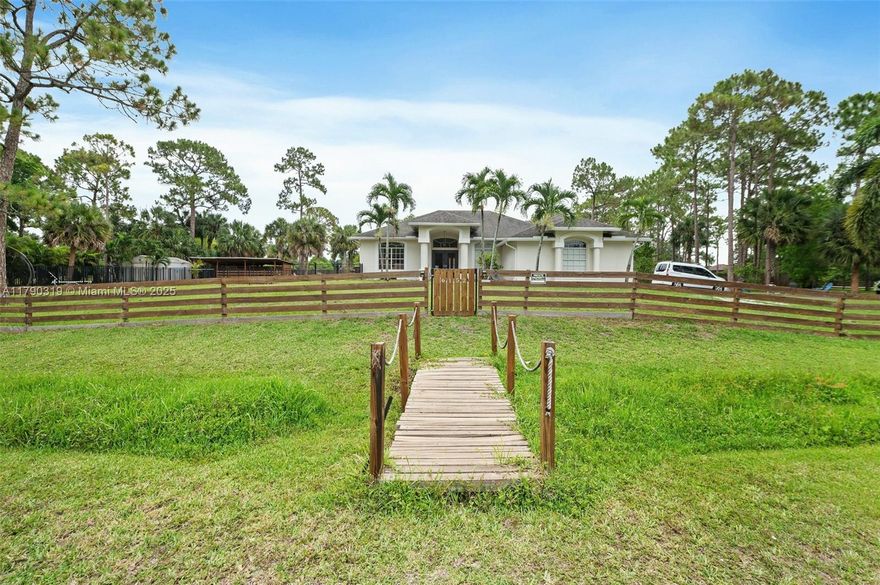 Beautifully house located in the best part of the acreage with quick and easy access to Turnpike and major throughfares. One acre plus with mature pine and Royal palm trees adorn this exceptional property. Three bedrooms plus a large office/den, high ceilings, new kitchen with quartz countertops; under the roof patio, newer Ac and new water heather ,New gutters. Heated pool and salt water surrounded by aluminum fence, horse stable and chicken coop, security camera will be include, well water, lawn and pool will be include in the rent's payment