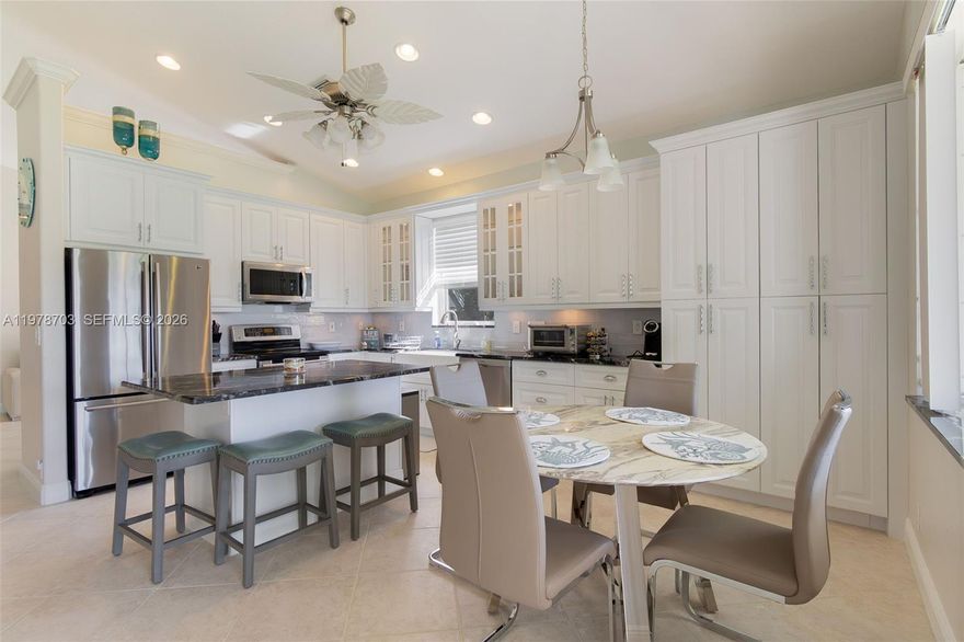 Welcome to this beautifully remodeled lakefront residence set on a rare oversized corner lot in the prestigious 55+ community of Baywinds. Filled with natural light and thoughtfully updated, this 3-bedroom, 2-bath home offers an elegant open layout designed to showcase its breathtaking lake views.
The gourmet kitchen features custom cabinetry, granite countertops, and stainless-steel appliances, flowing seamlessly into the main living spaces - perfect for relaxing or entertaining. The spacious primary suite offers generous walk-in closets and a refined en-suite bathroom with dual sinks and a beautifully remodeled, spacious shower. Additional upgrades include a new HVAC system, a new water heater, and a renovated two-car garage.
Enjoy resort-style living without country club fees at Baywinds, with three heated pools, a fitness center, tennis, pickleball, bocce, yoga, and a vibrant social calendar.
A rare opportunity to own a move-in-ready home with premium lake views and an exceptional corner-lot setting, perfect for enjoying the Florida lifestyle.
